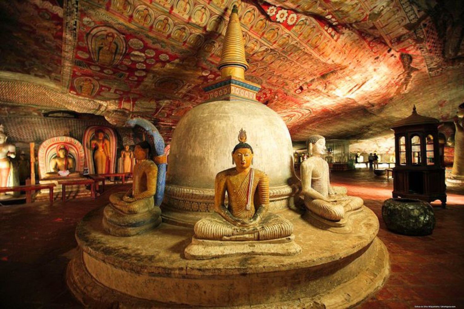 Large painted cave interior at Dambulla with Buddha statues
