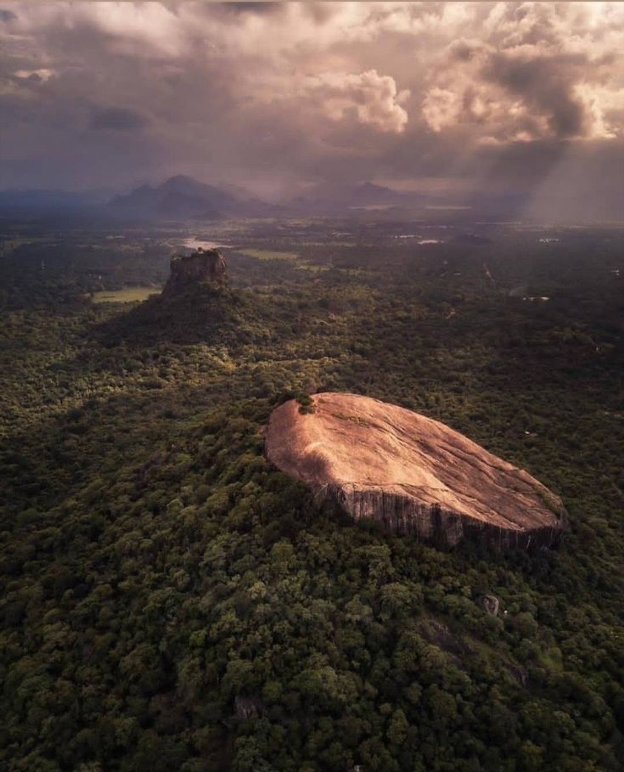 Aerial view of Sigiriya rising above the surrounding forest