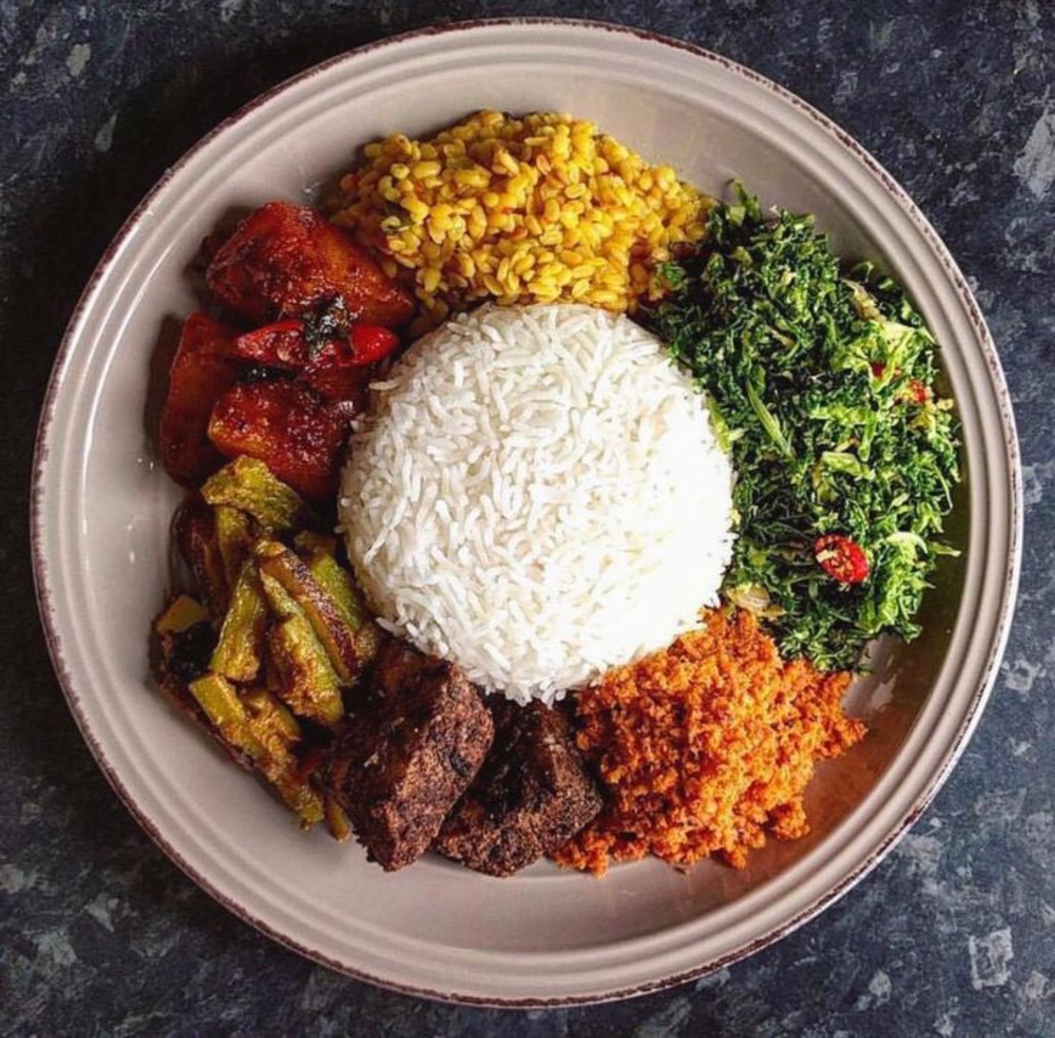 Sri Lankan rice and curry with vegetables and side dishes